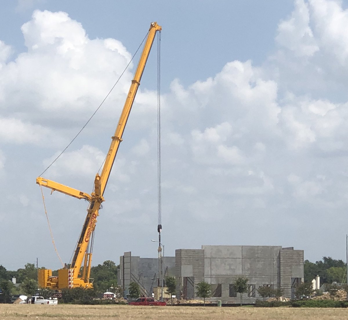 UrbanCompanies's tweet photo. We play with big toys!  Our new building coming along quickly, of course. Our team members are awesome! #cre #designbuild #generalcontractor #realestatedevelopment #katyTX #tiltup #cranes #teamwork https://t.co/L9M9ckJZ5X