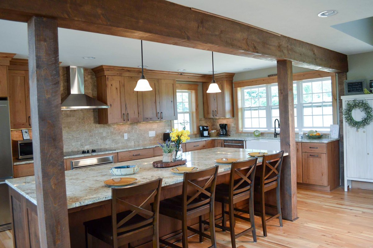 Studio76Kitchen's tweet photo. This farmhouse kitchen features a family-sized island with seating plus wood beams and hickory cabinets with old world character! https://t.co/JNscJMqTFL