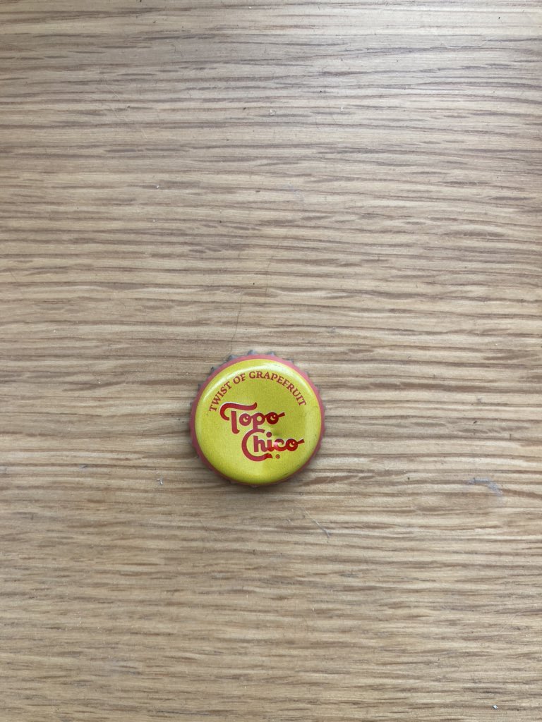 GoodRoadCo's tweet photo. .@TopoChicoUSA here’s some free design advice - the arc layout and “twist of” text on your cap appears to instruct users that the cap is a twist off when it’s not. It’s small but I notice it every time. https://t.co/FjAovGB5yK