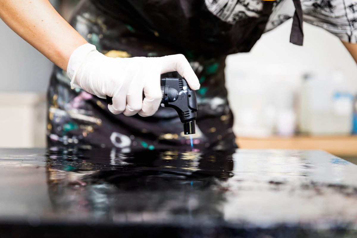 YoJolene's tweet photo. After a pour of resin it's important to use a gas burner to get rid of some bubbles. 
Some bubbles I want to keep in the art work. 
I just love how art can be a bit messy, it shouldn't be perfect, it has to be real. 
📸@dvshotz ⠀⠀⠀

#art #design #artistsofinstagram https://t.co/tN2oB8cFy9