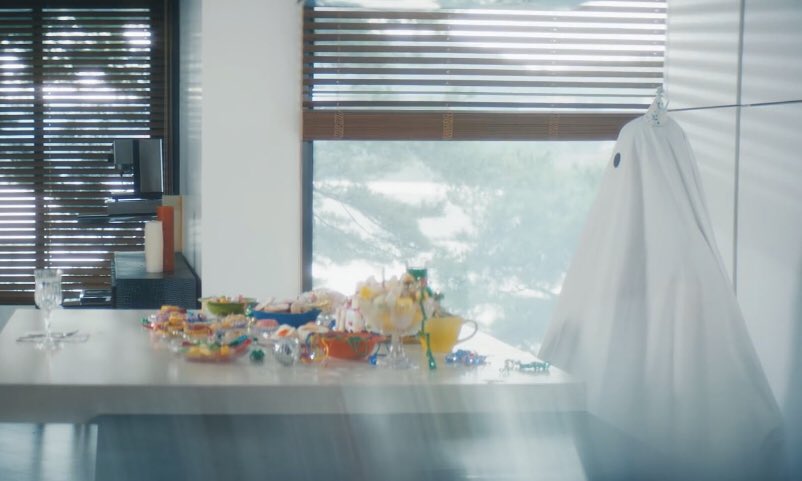 I thought about this too... the ghosts remind me of kids during halloween and the table is full of sweets, there are also toys in the living room, them jumping, the train that got wrecked, the pile of clothes. A lot of stuff that reminds us of childhood  https://twitter.com/districtfine/status/1301903561526108161