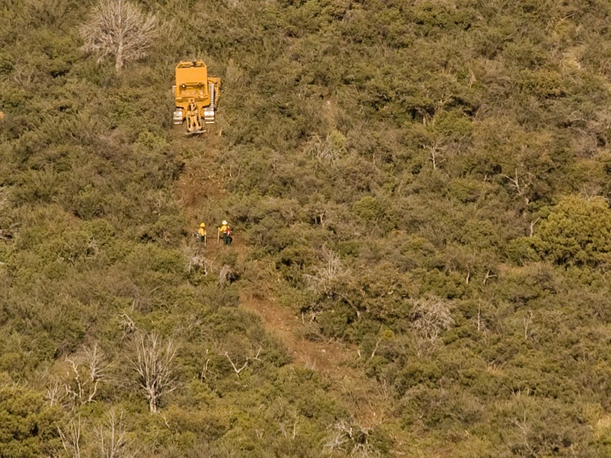 ForestServiceSW's tweet photo. #FireFriday Fire behavior can be extreme in steep terrain. It is sometimes unsafe for firefighters to use #DirectAttack tactics. Instead they use #IndirectAttack tactics. Bull bulldozers and crews work together to make lines in strategic locations that will containing the fire. https://t.co/R86FJlUQvh