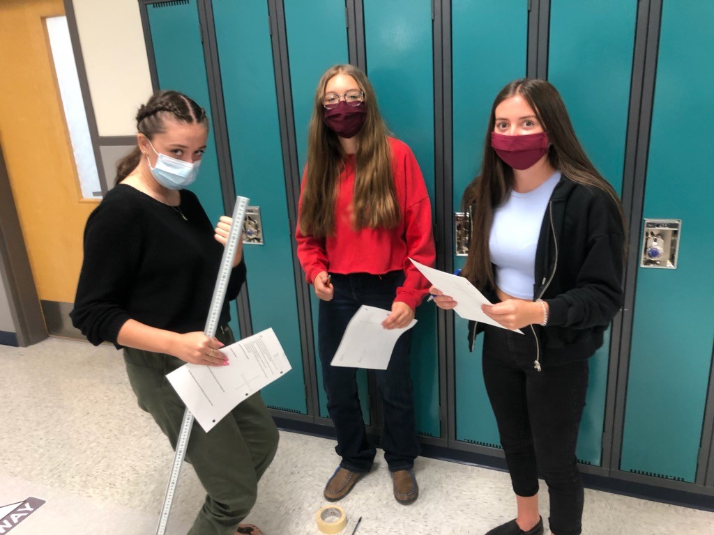 EagleButtePRSD8's tweet photo. Mr. Robinson's Period 2 Physics 20 class busy in the hallways learning about vectors #eaglebutte #EBHS #prsd8 #physics20 #vectors https://t.co/sXgzpR4tiw