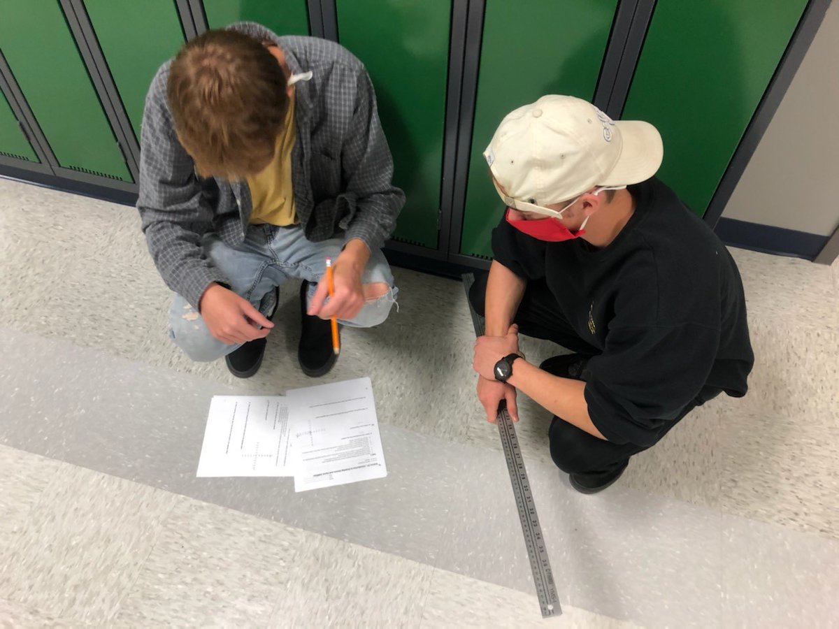 EagleButtePRSD8's tweet photo. Mr. Robinson's Period 2 Physics 20 class busy in the hallways learning about vectors #eaglebutte #EBHS #prsd8 #physics20 #vectors https://t.co/sXgzpR4tiw