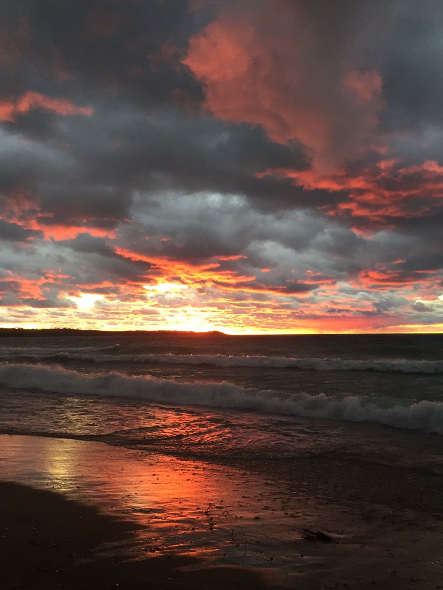 Thanks to Chuck Fraenkel who shot this sunset from Glen Arbor beach on 8/29/20, who says: 
"I don’t think any of the 50 or so people who were there will forget this. There was simultaneously a full rainbow in the opposite direction. Taken with an old IPhone and not edited.