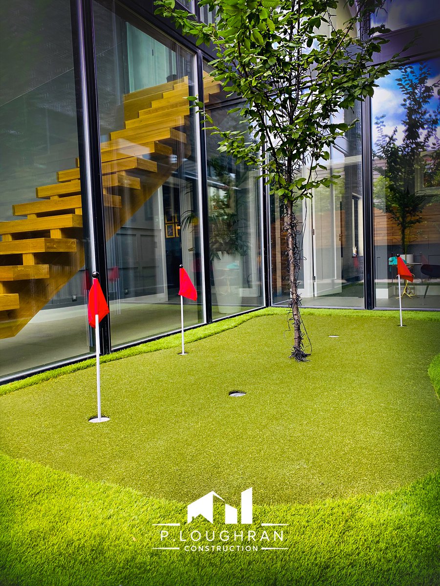 PLoughranConst's tweet photo. P. Loughran Construction developments come with all the necessary features. A welcome distraction from this home office! Winking face @PrideArtificialGrass adds a unique putting green to this luxury property. Ideal for practicing day or night #buildingireland #architectureireland https://t.co/ysm0qEfhhF