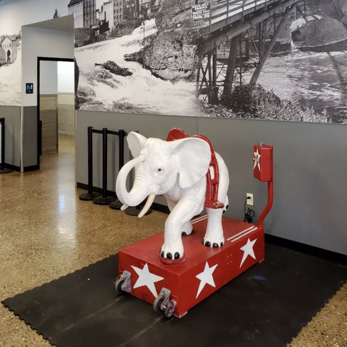 RiverfrontSpo's tweet photo. 🐘 NOW ACCEPTING RIDES: Isidore has made the move over to his temporary home at the Numerica SkyRide building! The elephant will remain 10 cents to ride (dimes available at the cashier counter). His permanent home will be in the Looff Carrousel building once it re-opens. https://t.co/lob4976Ylt