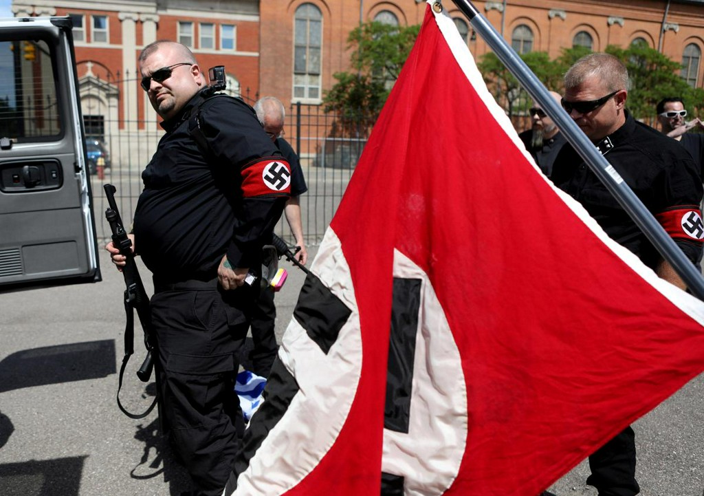 Reuters's tweet photo. White nationalism upsurge in U.S. echoes historical pattern, say scholars https://t.co/YT0MMMuL6N https://t.co/rFXiRfNONr