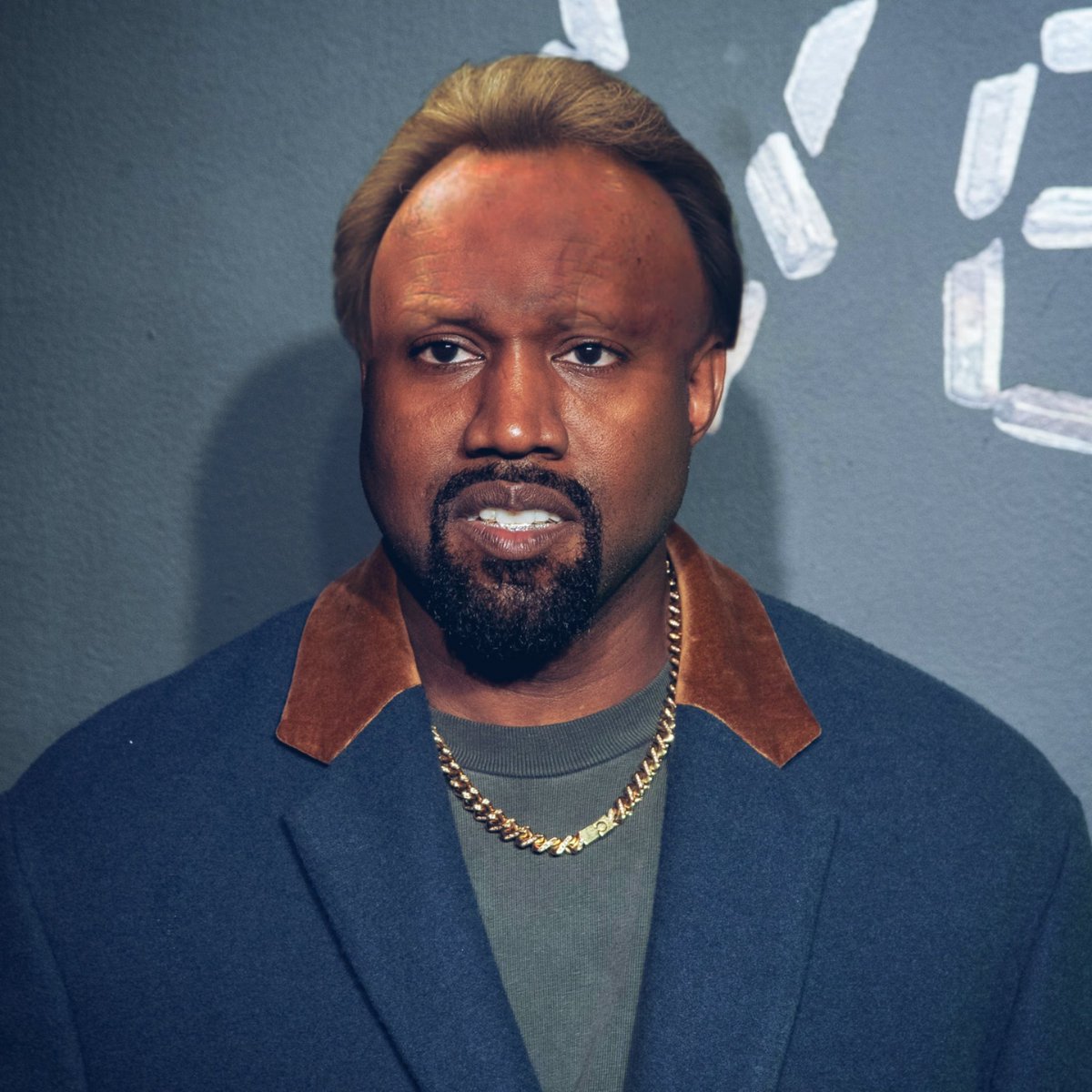 visualsatire's tweet image. Kanye West with the hair and brow of Neil Warnock
