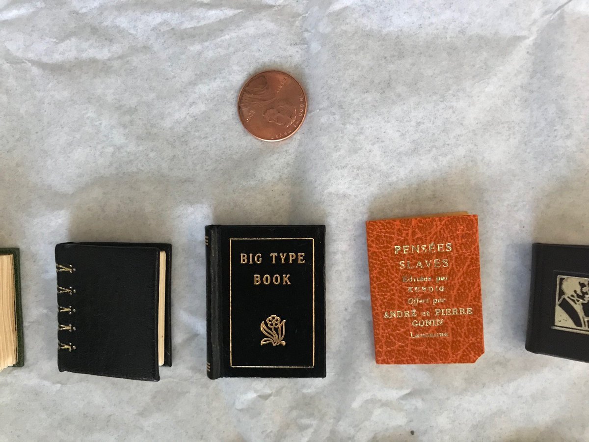 The  #Rosenstaff is carefully installing it for visitors to see once we reopen. Our librarian is even cataloging each of the tiny bound books for our fine press collection! Penny for scale.