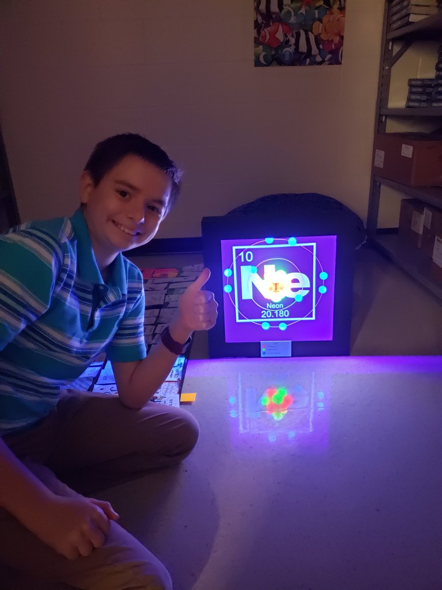 drms_chiefs's tweet photo. In 8th grade, students in Ms. Harper's class built models of atoms to show mastery of Standards. Gabe DeLashmutt knocked it out of the park with his blacklit neon Neon! I think we have a scientist in the making! #DRMSClassof2025 #DRMSstem https://t.co/Hy5rX0EGjt