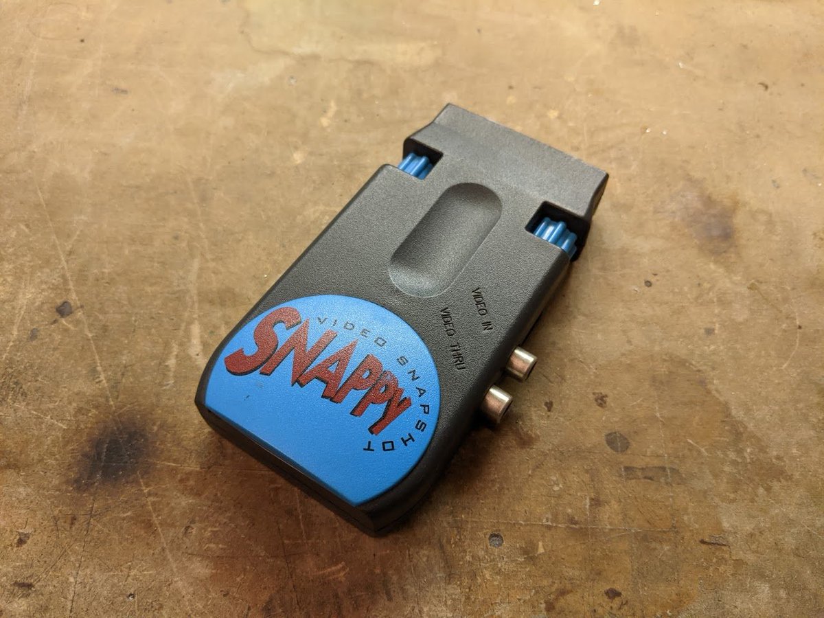 here's a fun piece of (very) 1990s hardware: the Snappy Video Snapshop, from a company called Play, Inc. it is a video digitizer, so video goes in one end...