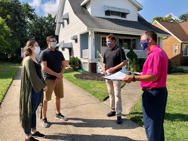 ParmaMayor's tweet photo. Ward 3 Councilman Mark Casselberry and I gave newlyweds Melanie &amp; Tyler Tapajna a Citizen of the Month Award &amp; Parma Pride sign. Following their wedding ceremony and while stilled donned in formal attire, the couple served their donated reception meals to Laura's Home residents. https://t.co/bh7DUNfIVz