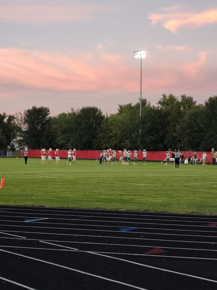Carjam95's tweet photo. Friday night lights...Go BH Braves! Tough fought win in double OT. Great game! That sky and sunset😍! #sdsunset https://t.co/5sYnhxdJiG