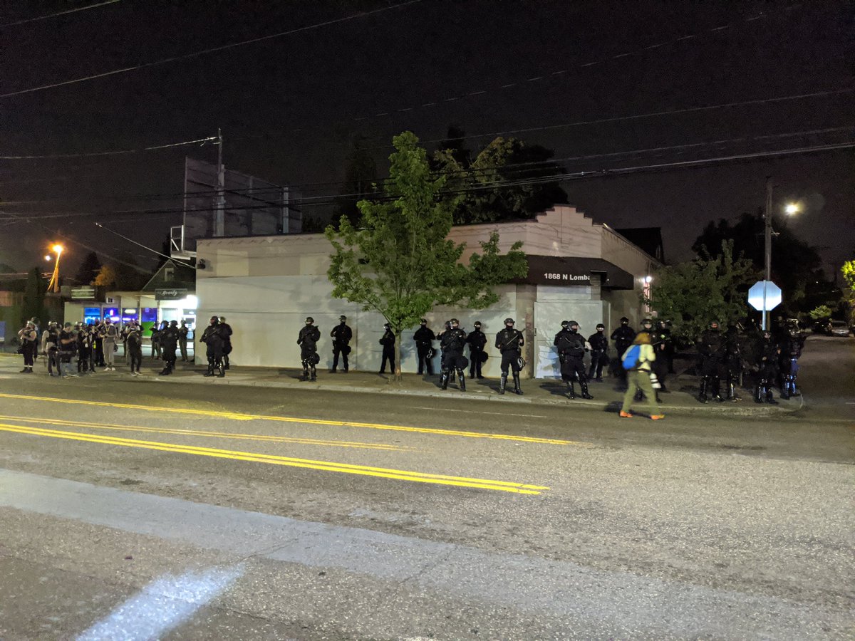 Boy howdy it's a lot of riot cops tonightThe activist on the megaphone reminds the crowd that they will rush. To be prepared. To pick up the megaphone if he goes silent and keep this going