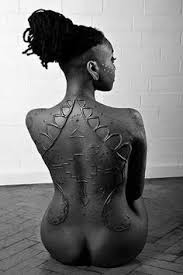 t11/ Modern Scarification;Scarification, or Tribal Mark's as referred to currently, are slowly disappearing and being replaced by tattoos.  Modern Tribal Mark -Moniasse Sessou, Artist/ Model with roots from Benin.