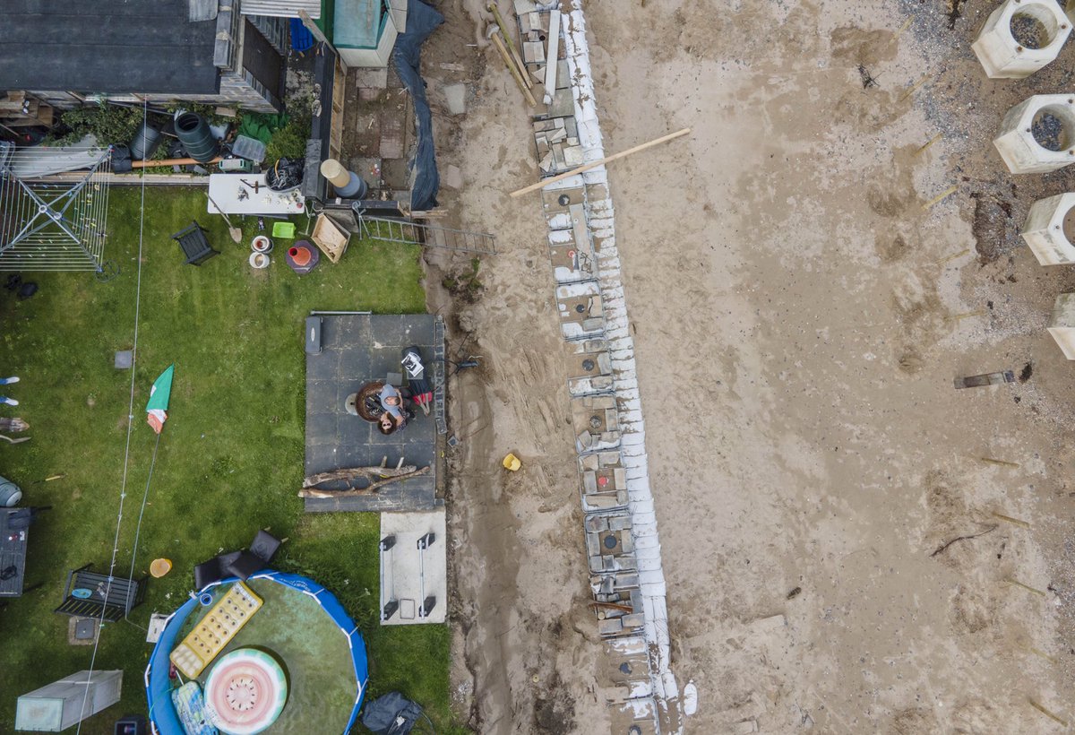 Gasheman's tweet photo. David Shevlin stands where his back garden used to be, unless Fingal Co take action, his house will be taken by the sea in less than five years. Pic by Gary Ashe #irishdailystar #coastalerosion #portranebeach @IsFearrAnStar https://t.co/AGEJE9F6TN