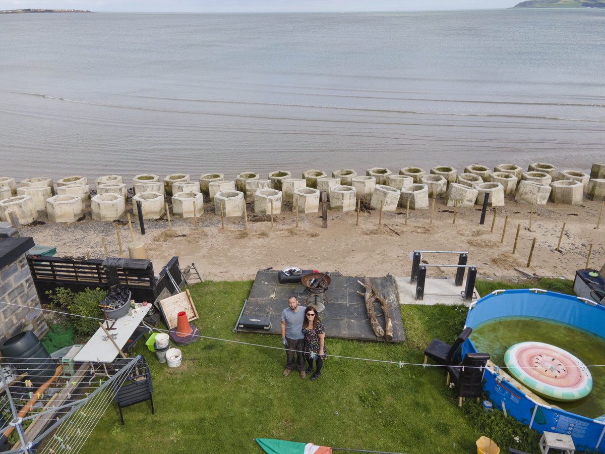 Gasheman's tweet photo. David Shevlin stands where his back garden used to be, unless Fingal Co take action, his house will be taken by the sea in less than five years. Pic by Gary Ashe #irishdailystar #coastalerosion #portranebeach @IsFearrAnStar https://t.co/AGEJE9F6TN