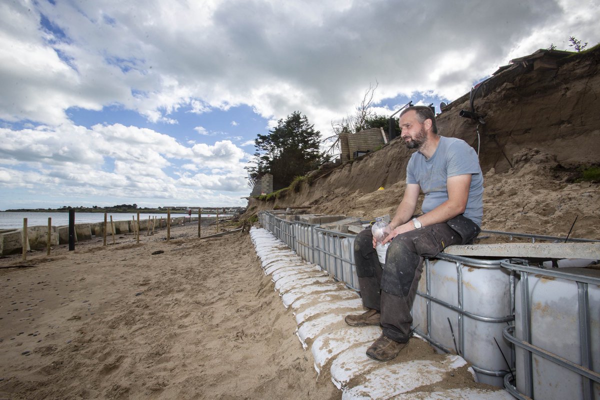 Gasheman's tweet photo. David Shevlin stands where his back garden used to be, unless Fingal Co take action, his house will be taken by the sea in less than five years. Pic by Gary Ashe #irishdailystar #coastalerosion #portranebeach @IsFearrAnStar https://t.co/AGEJE9F6TN