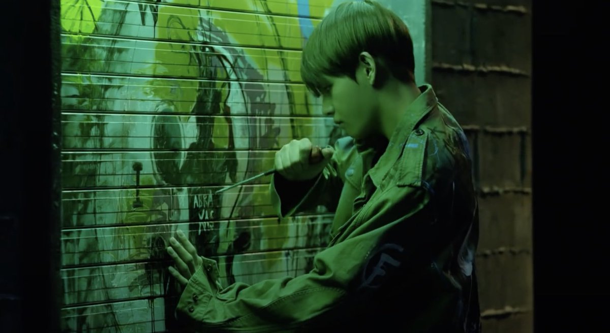 In MAMA, Hoseok is in isolation when a doctor checks in and pills start to flood into his room. He takes one, and a scene with a cocktail glass filled with pills similar to that in LIE is shown. This was quickly followed by his left eye showing Taehyung’s graffiti of Abraxas, as