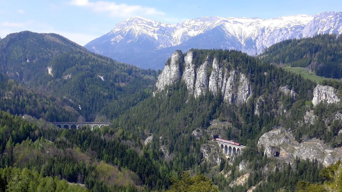 3/ The Semmering Railway, connecting Vienna and Graz through the homonym pass, is considered the first mountain railway. Opened in 1854, it climbs up the mountains with tunnels, large stone viaducts and a very long (for the time) summit tunnel of 1.4 km