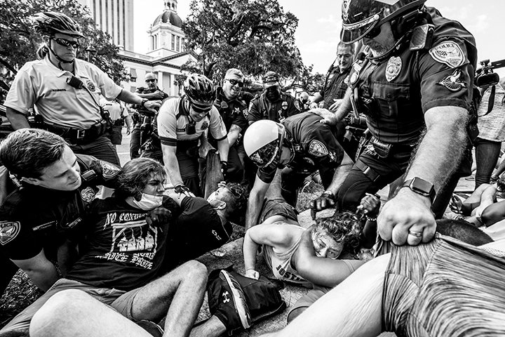 Protestors clash with law enforcement officials near the Capital building in downtown Tallahassee, Fla., on Saturday afternoon, Sept. 5, 2020.

A Leon County grand jury announced Friday that no charges would be filed against three Tallahssee Police officers in seperate shootings.