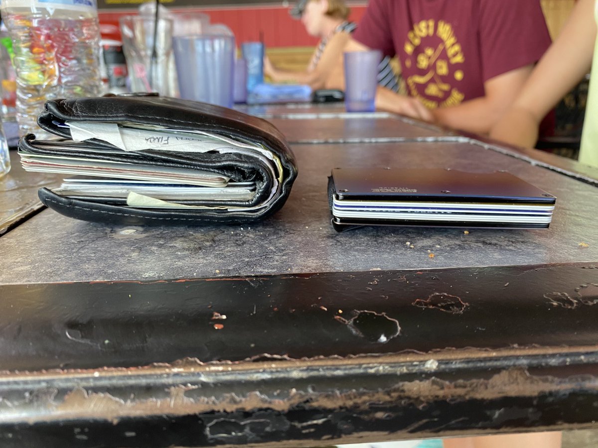 ChrisMWilliams's tweet image. My dad’s wallet vs. mine. He is George Constanta.