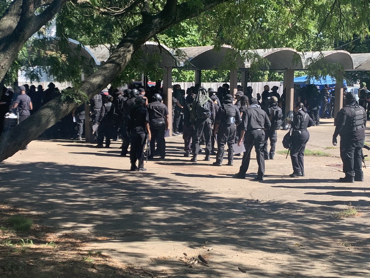 It sounds like everyone is lined up to do a “weapons check” with a few leaders of the group. “If you’re only carrying a pistol, you will not be allowed in this formation.”