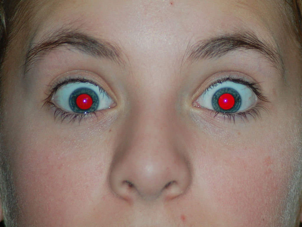 So… onto those ‘glowing eyes’. We’re all familiar with ‘red eye’ that can occur as camera flashes hit an animal’s eyes, even those of people (photo by PeterPan23). But here’s the thing…