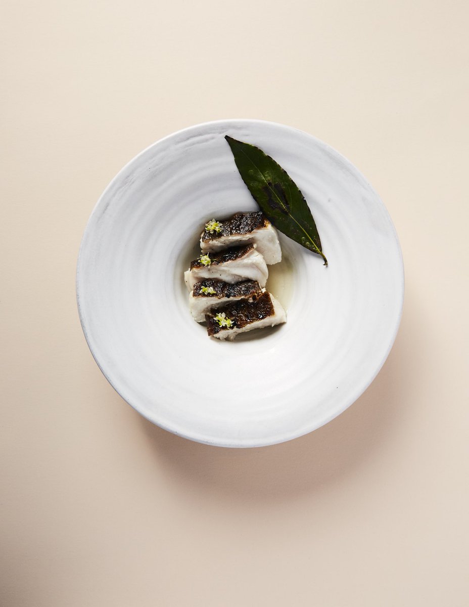 Halibut, grilled over bay leaves and bay branches.