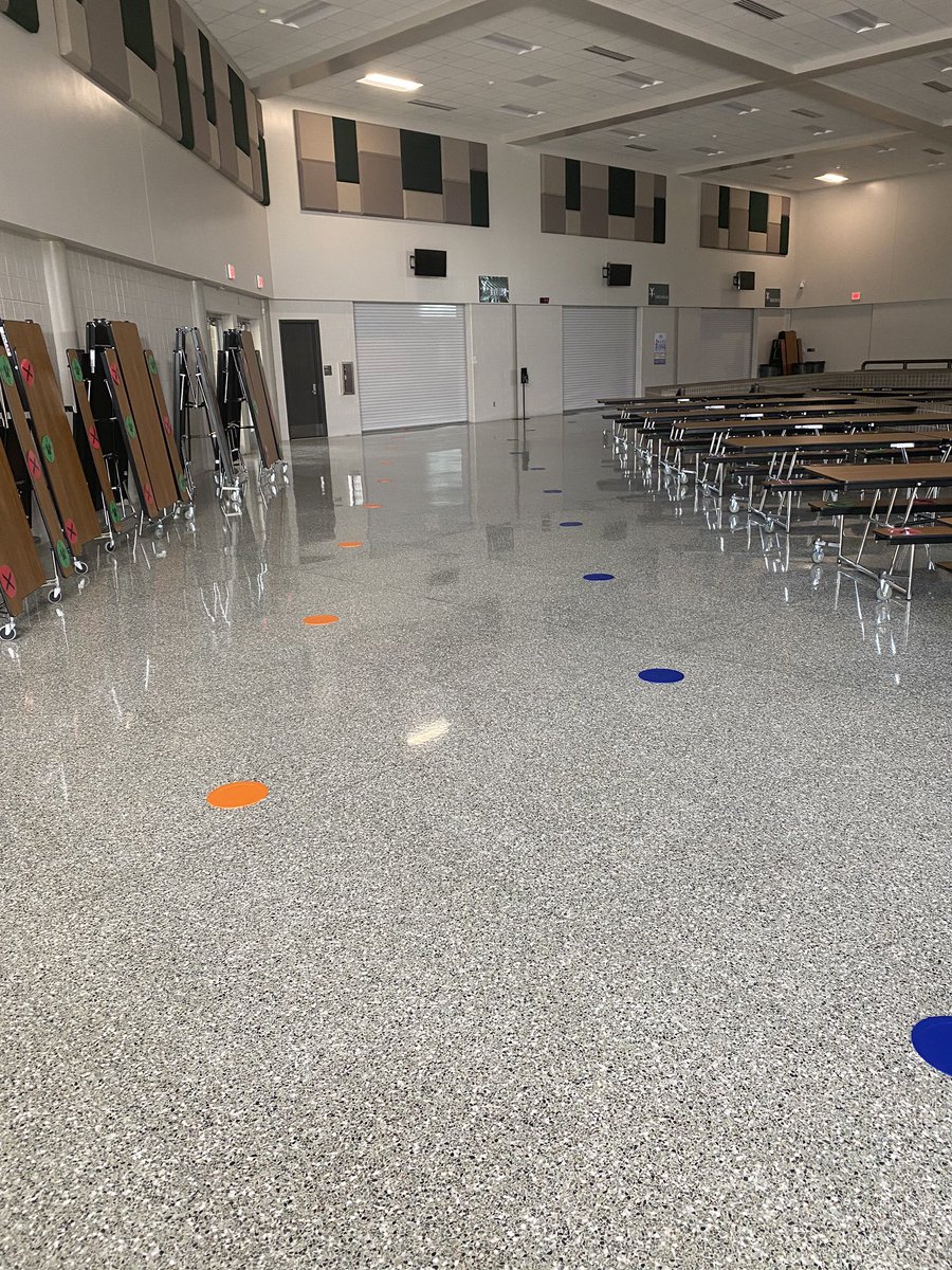 APMrG212's tweet photo. Tables in the main commons and 9th grade commons are green and red dotted for social distance seating and social distance dotted for cafeteria lines! 

#MaydeForThis https://t.co/L06YTcXweM