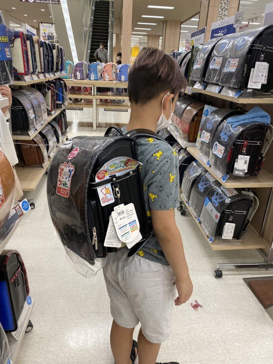 My son starts school later this week to get him mentally prepared, my wife has taken him school shopping. In Japan, kids have the same backpacks when they are in elementary. They're leather-ish bound & sturdy design.See my son trying them on & one he picked (neon, of course.)