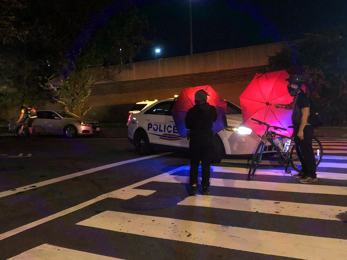 Protesters have been using umbrellas all night to block the cameras of onlookers and police officers who try to film the demonstration from their cruisers.  #DCprotests