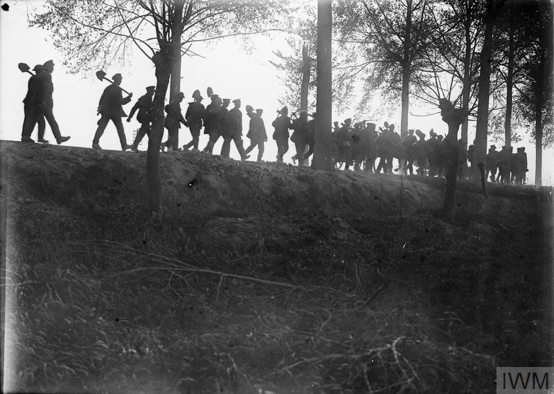 ThisDayInWWI's tweet photo. Sep 6 1917 During the Battle of Passchendaele war photographer #ErnestBrooks takes this silhouette photo, IWM Q 2992, of a Labour Battalion returning to base, near Ypres. #OffToWorkWeGo https://t.co/AERyYfqu5o https://t.co/1T7TZTrGK2