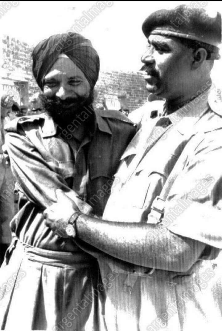 Subedar Ghulam Muhammad, 15 Punjab (Pak Army) greets Lt Col Anant Singh, CO 4 Sikh (Indian Army) as he arrives at prisoner of the war camp near Lahore in 1965.It was the first meeting of the two since they fought together in World War II.[1]