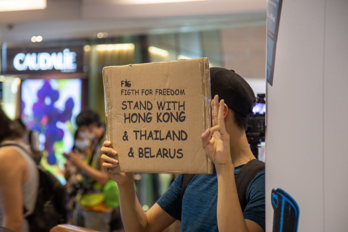 hkfp's tweet photo. A demonstrator who gave his name as V told HKFP that he prepared a placard reading "Stand with #HongKong &amp; #Thailand and #Belarus" because he thought there were different forms of suppression in the different countries. https://t.co/dzIfBCMihS