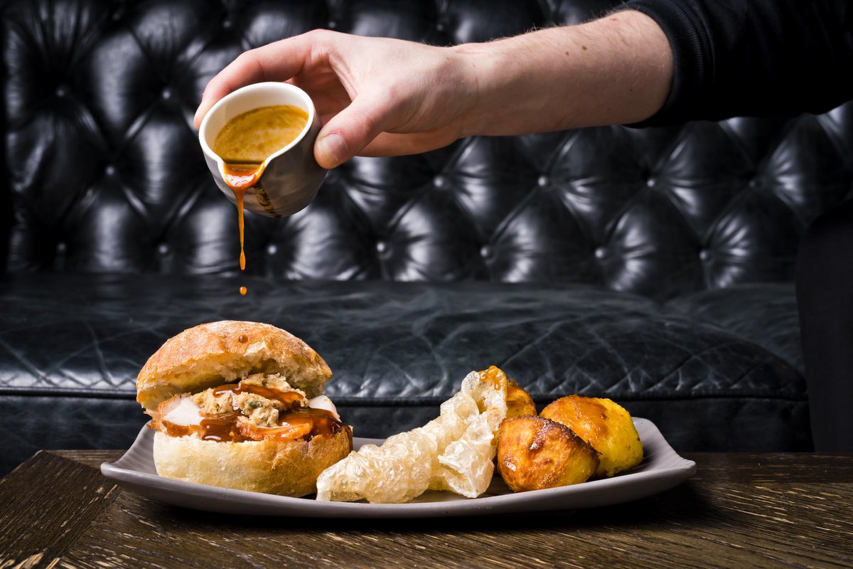 TheRefugeMcr's tweet photo. ‘Tenner Well Spent’ - A Roast Pork and stuffing bap, roast potatoes, pork crackling a with a pot of Apple sauce and a jug of gravy for all your dipping needs. ⁣
⁣
Available in the Bar and on the Refuge Terrace, perfect to satisfy those Sunday hunger pangs. ⁣
⁣
#backtorefuge https://t.co/HT9tZHYC1B