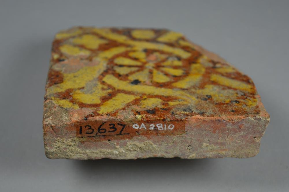 Surviving Medieval floor tiles. Note relief on two of the examples.