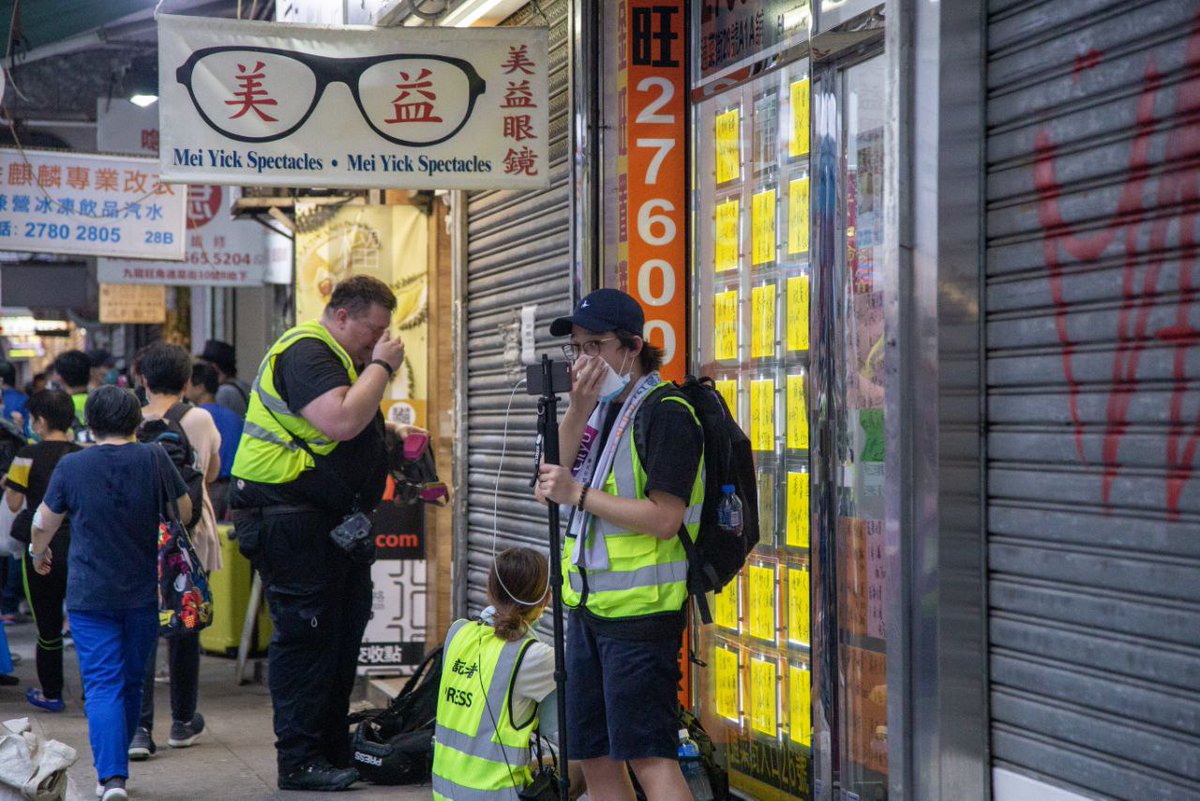hkfp's tweet photo. @StandNewsHK Journalists and citizens coughed and sneezed after police deployed the pepperball gun on Shantung Street in Mong Kok. 

Police have raised the blue banner to warn against unlawful assembly https://t.co/xc9IzTx2Z3