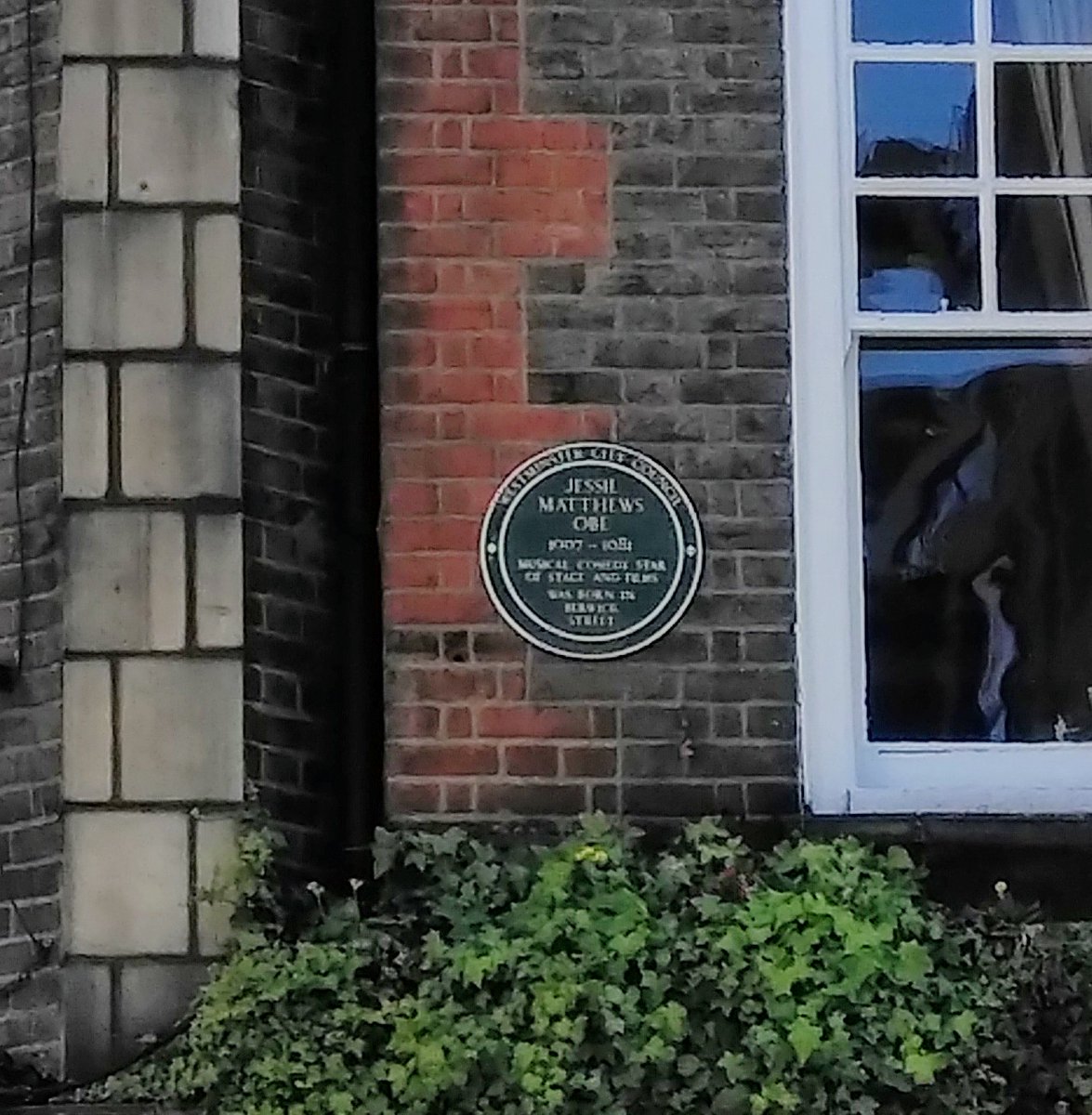 BitesSoho's tweet photo. It's a slightly fuzzy pic but the plaque on the #BluePosts pub says Jessie Matthews was born on @berwickstlondon. It really should also say that she had her first dancing lesson in an upstairs room of the pub - but which window would it have been??? https://t.co/sYvMuBYsy5