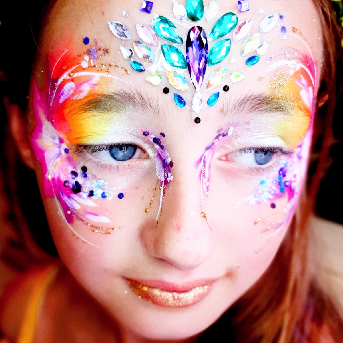 Birthday girl with sparkle, colour and gems #tickboomfacepainting #facepainting #Brighton #festivalfaces #festivalmakeup #glitter #weddingideas #corporateevents #eventideas #brightonevents #eventprofs #eventprofessionals #eventprofsuk #londonfacepainter #brightonfacepainter