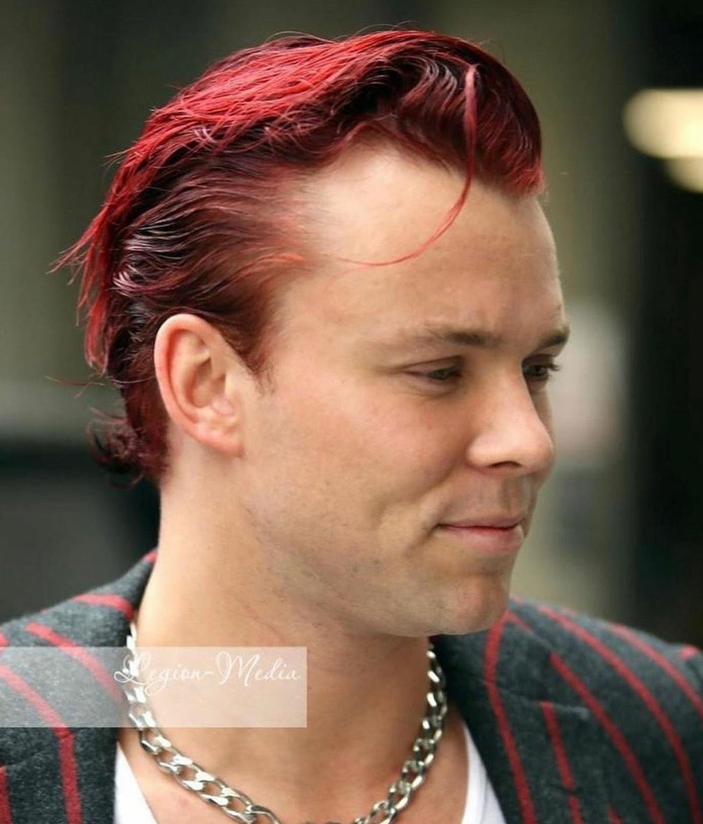 Ashton with single strand of hair on his forehead, a thread