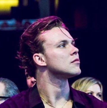 Ashton with single strand of hair on his forehead, a thread