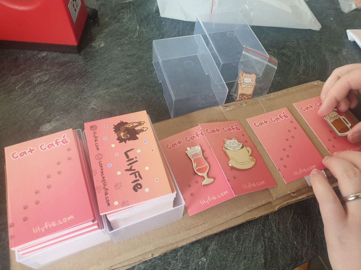 Lily_Fie's tweet photo. Went to FedEx yesterday to pick up my enamel pins early, didn't want to wait for Monday post 😋 Packaged all of the Kickstarter pledges, feel free to order yours now to get them shipped by Monday! https://t.co/33LYDwbD01 https://t.co/Odzv2cP1Dy