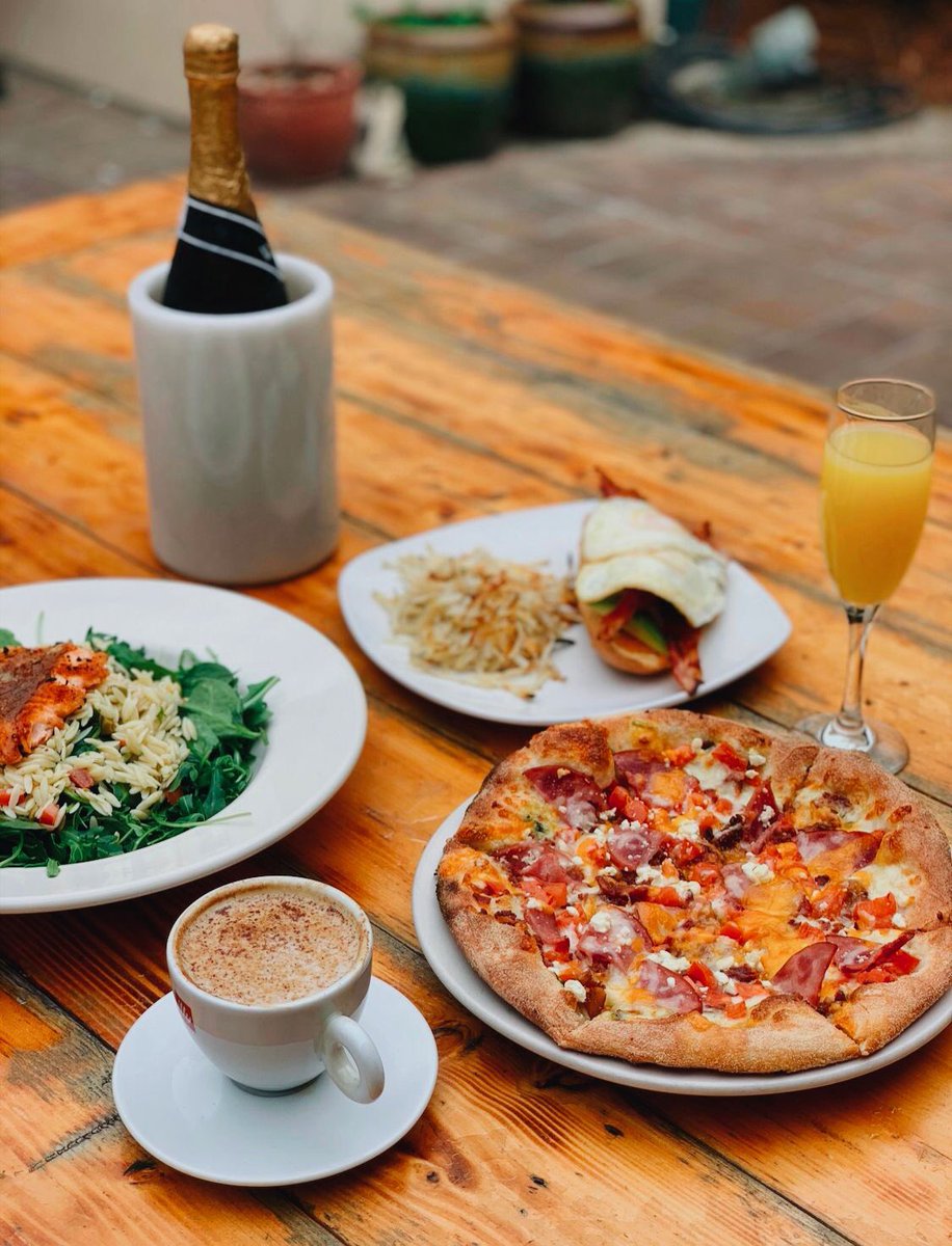 A patio brunch spread feels complete w/ options: breakfast pizza, avocado bacon sandwich, + more. Our menu is full of breakfast + lunch staples — every weekend, 11am-2pm. 🥂 🥓 Take a peek at our full menu to pre-plan your order: zasbrickovenpizza.com