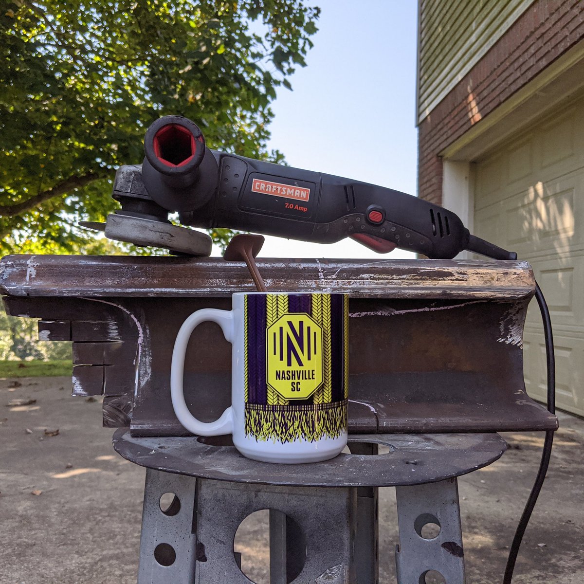 Jeffydubbs's tweet photo. A nice cup of tea, an angle grinder, a project to work on and it's @nashvillesc game day! Let's get this! #beginnerblacksmith #railroadanvil #nicecupoftea https://t.co/H5UgC5FJZl