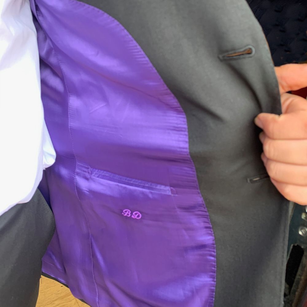 Our student is dressed for success! His 'express-service' suit is made-to-measure from black, hard-wearing, Italian, lightweight 100% wool -with an extra pair of trousers &amp; school badge neatly sewn in place. How gorgeous is the lining!  Back-to-school has never looked this good!