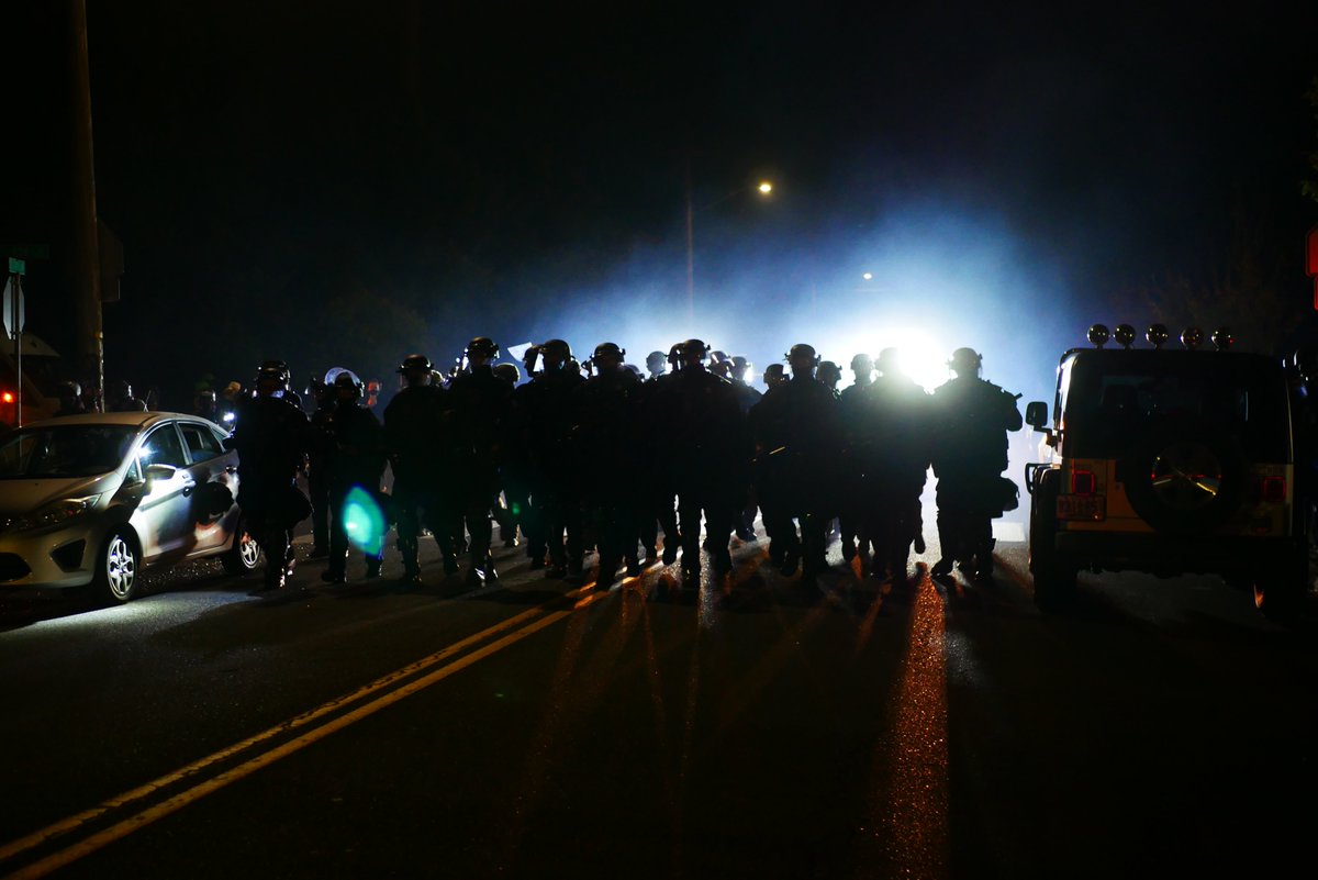 9/6 0036 Protesters regroup back at Ventura Park and police advance again. Gas is used, a firework explodes as protesters retreat once more. #pdxprotest  #BLM  #portland  #blacklivesmatter    #portlandprotest  #defendpdx  #BLMprotestsvideo:  https://twitter.com/BaghdadBrian/status/1302552570792083456