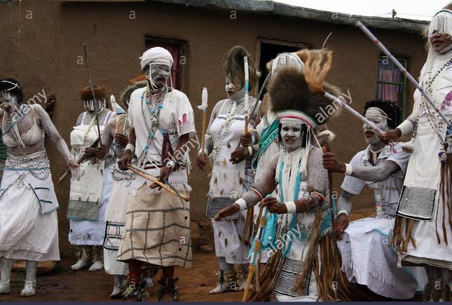 To see them dancing in their snow white and black patterned regalia, waving their red-clay-smeared-arms in the air while chanting songs that I had no doubt carried the very essence of what it meant to be African.