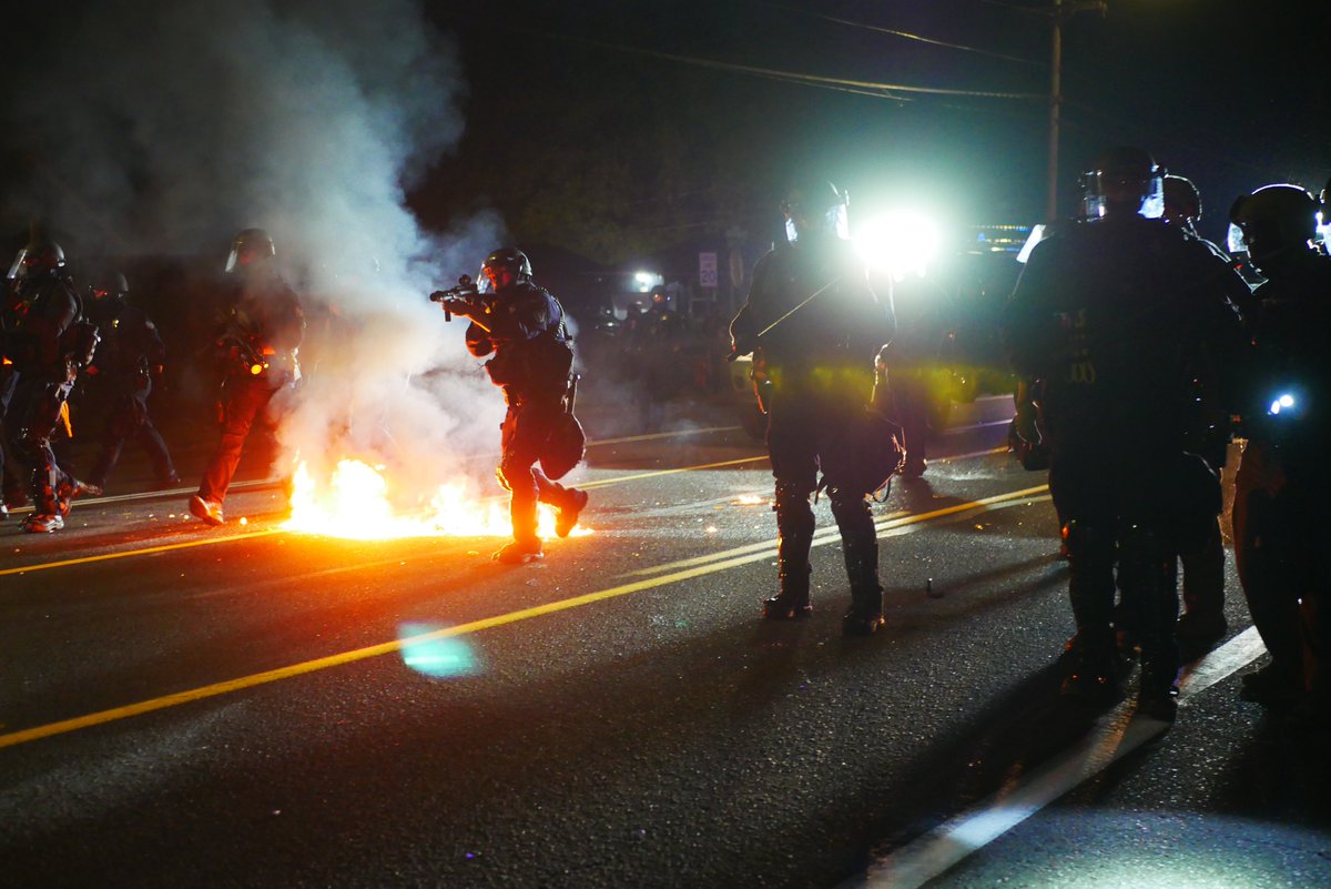 9/5 2114-2119 Shield reading "100 DAYS 100 NIGHTS" waits for PPB advance before a molotov is thrown. Event is quickly declared a riot and shield wall retreats.  #pdxprotest  #BLM  #portland  #blacklivesmatter    #portlandprotest  #defendpdx  #blmprotestvideo here:  https://twitter.com/BaghdadBrian/status/1302464110676729857